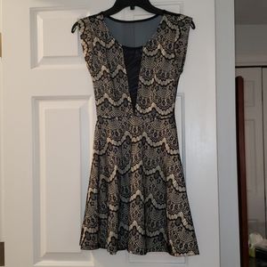 Black and cream lace dress with sheer detail